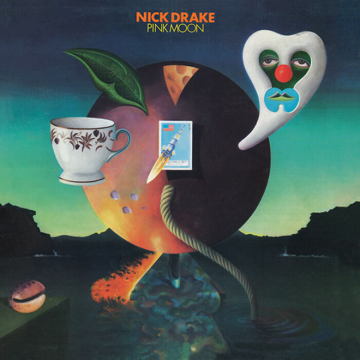 Surreal '70s album cover of Nick Drake's "Pink Moon" featuring a teacup and abstract shapes against a dark backdrop.