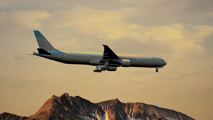 Airplane flying over mountains during sunset, highlighting intriguing facts about aviation and travel.