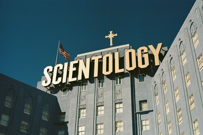 Building with "Scientology" sign, showcasing religious architecture under a clear sky.