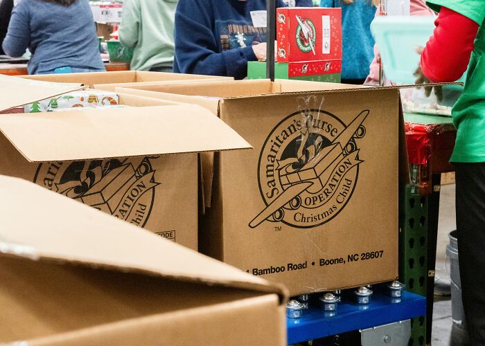 Volunteers packing Samaritan's Purse boxes.