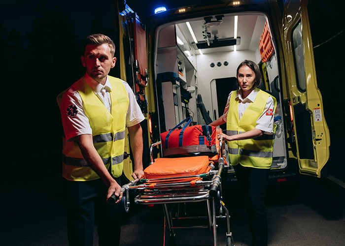 Ambulance scene with paramedics, highlighting coworker incident and consequences.