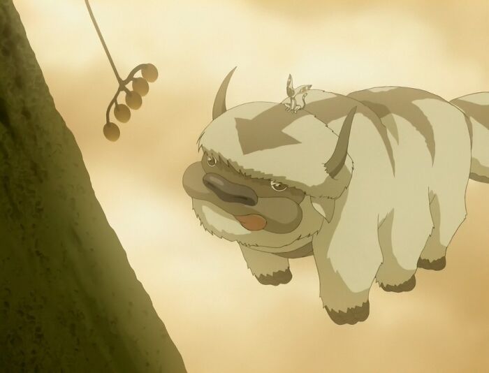 Flying creature with an arrow on its head, depicted in an animated tear-jerking movie scene, chasing dangling fruit.