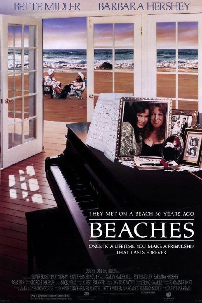 Movie poster for "Beaches" featuring a piano, framed photos, and a beach scene through open windows.