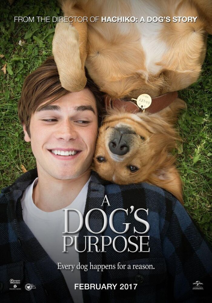 Smiling young man lying on grass with a dog, promoting the tear-jerking movie "A Dog's Purpose" set for release in February 2017.