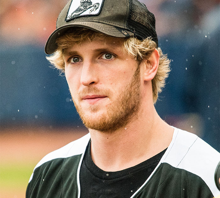 Blonde man in a baseball cap and black shirt, relevant to celebrity secrets.