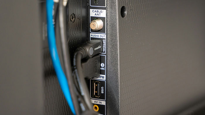 Back view of a TV with HDMI and USB ports visible, illustrating common tech setup in America.