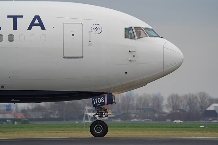 Airplane on a runway, highlighting financial waste in historical aviation projects.