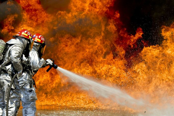 Firefighters battling intense flames at a billionaire's house fire in LA.