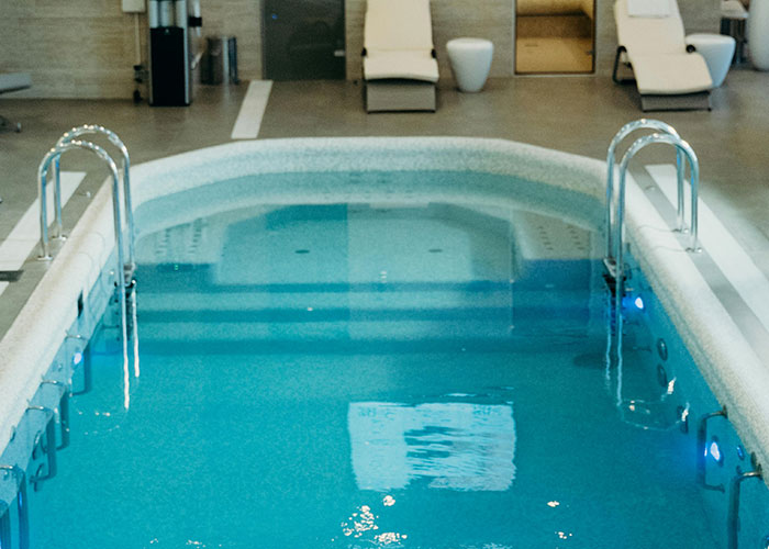 Indoor swimming pool in a spa center, related to unsolved mysteries from various countries.