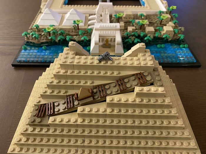 Lego pyramid model with hidden surprises and a river in the background.