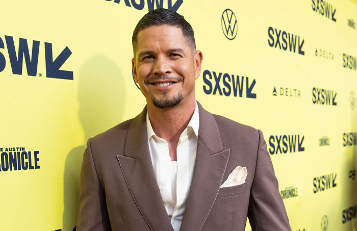 JD Pardo in a brown suit at SXSW event, representing the cast of High Potential.