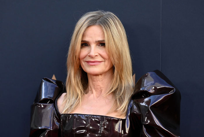 Kyra Sedgwick in a shiny black dress at a formal event, part of rising stars cast.