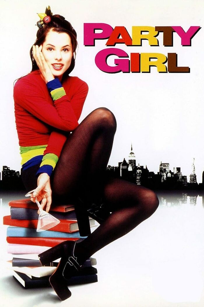 Best nostalgia movies cover art featuring woman in colorful outfit sitting on books with a cityscape background.