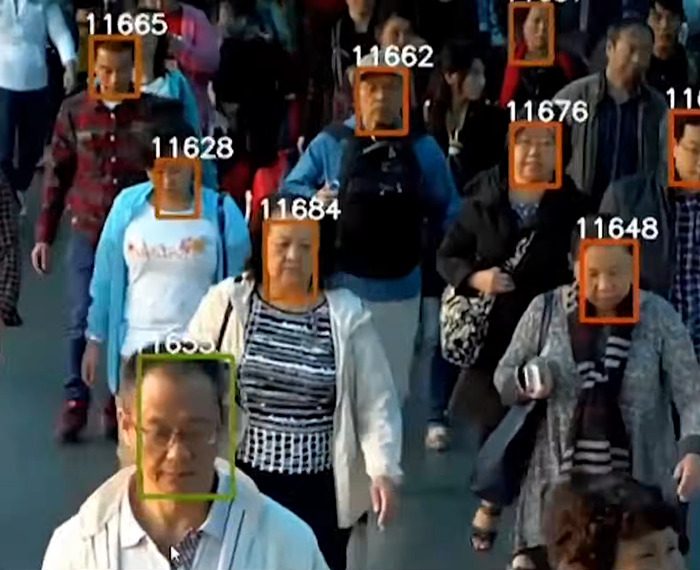 A crowd of people, some with digital face-tracking overlays, illustrating Chinese-Canadian commentary on misconceptions about China.