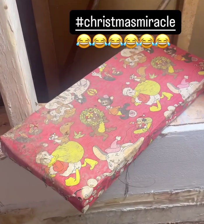 Decades-old Christmas gift found during home reconstruction, wrapped in festive paper.