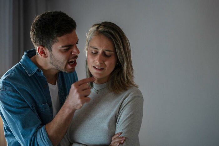 Man angrily confronting woman, highlighting a situation that seemed normal but is messed up when viewed with maturity.