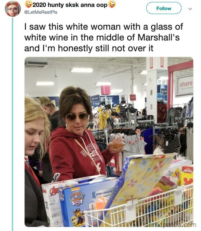 Woman in sunglasses at a store with a glass of white wine, showcasing moms behaving humorously.