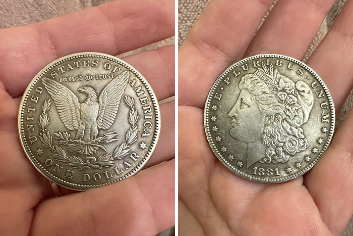 Hand holding 1881 silver dollar coin with eagle and Liberty design, a numismatist's treasure from the United States.