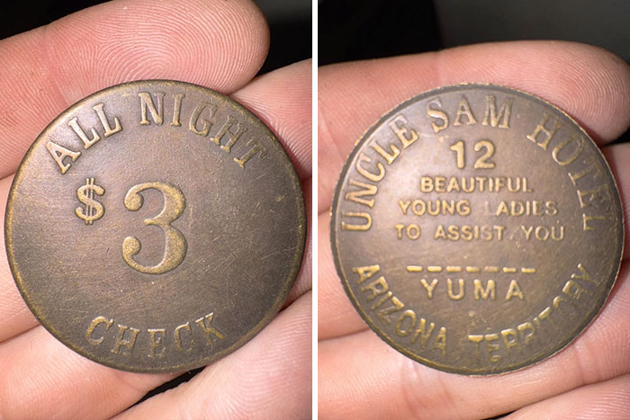 Close-up of a vintage coin featuring all-night check and hotel details, a numismatist's treasure.