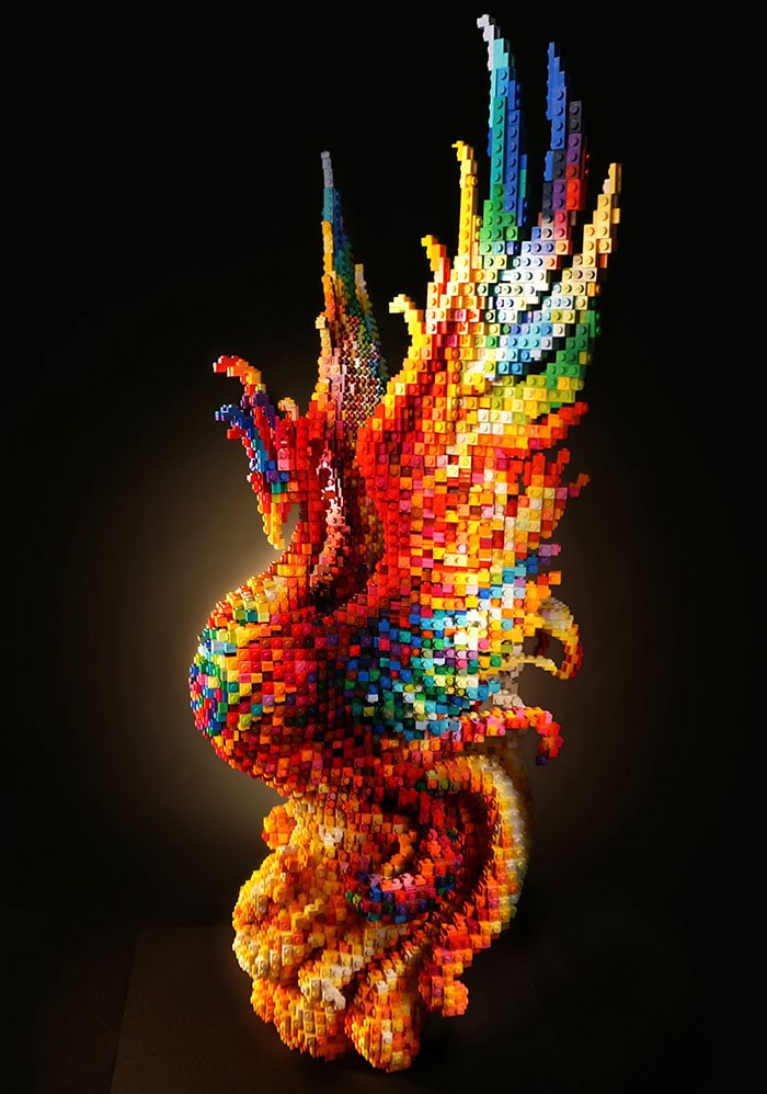 Colorful LEGO phoenix sculpture showcasing intricate brick artistry.