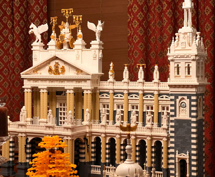 Intricate LEGO build of a grand architectural structure with columns and statues.