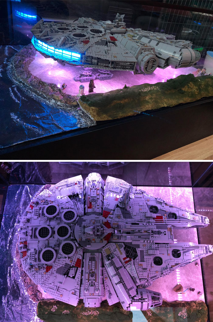 LEGO spaceship build with glowing lights and intricate details displayed on a stand.