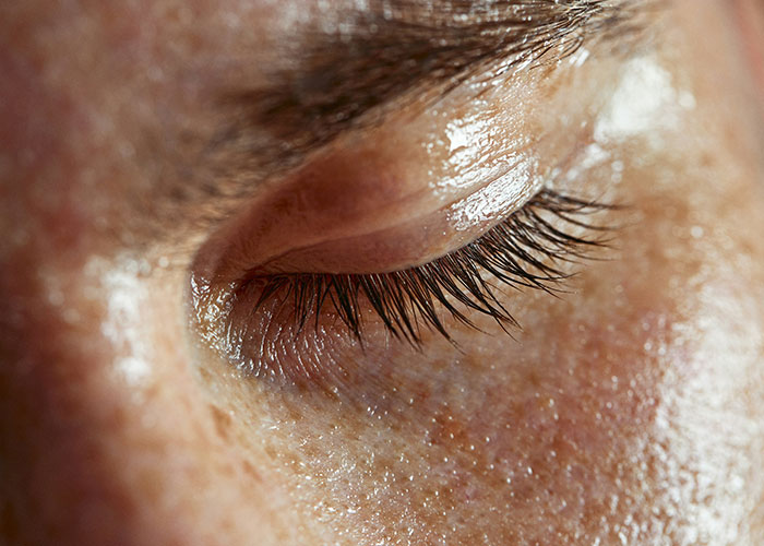 Close-up of a closed eye, highlighting skin texture, relevant to unsettling medical facts.