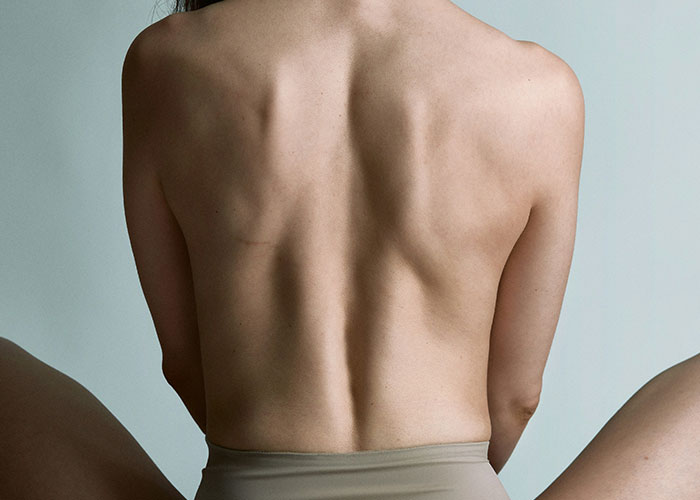 A person's back showing vertebrae structure, linked to unsettling medical facts.