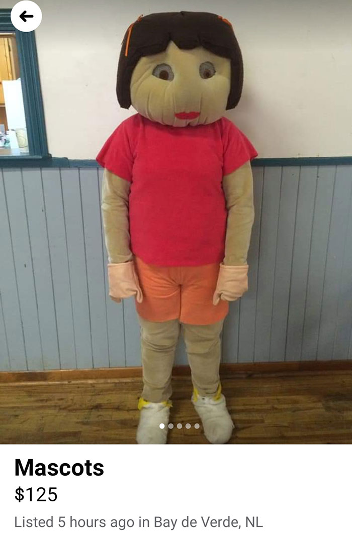 Creepy mascot costume for sale online, featuring a handmade figure in a red shirt and orange shorts.