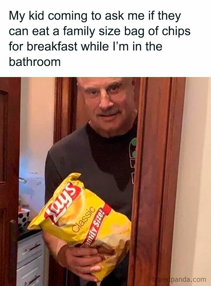 Dad holding a family-size chips bag in the bathroom, humorously illustrating dad life struggles.