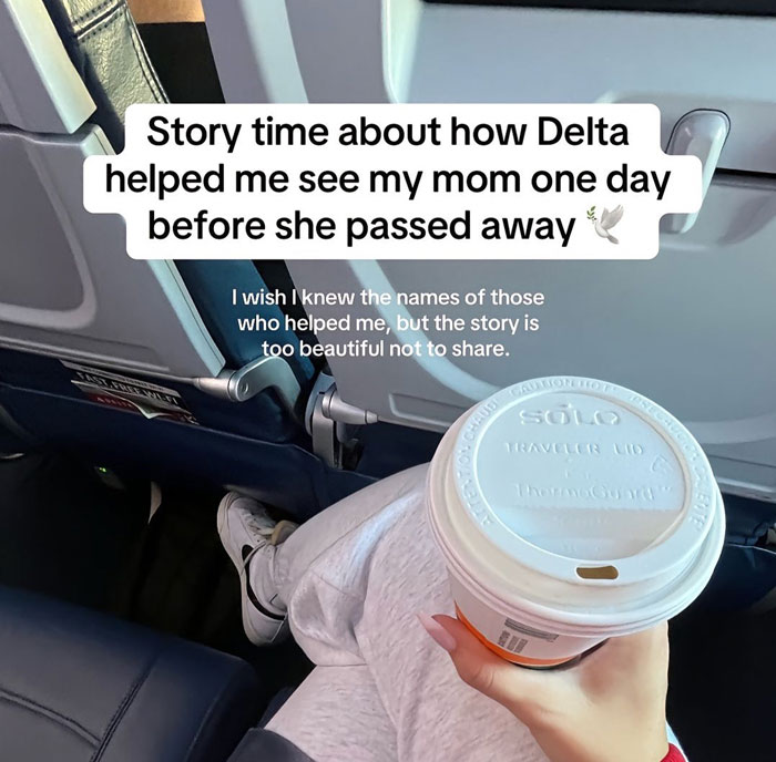 Airline assists woman to see terminally ill mother, seated on plane holding a coffee cup.