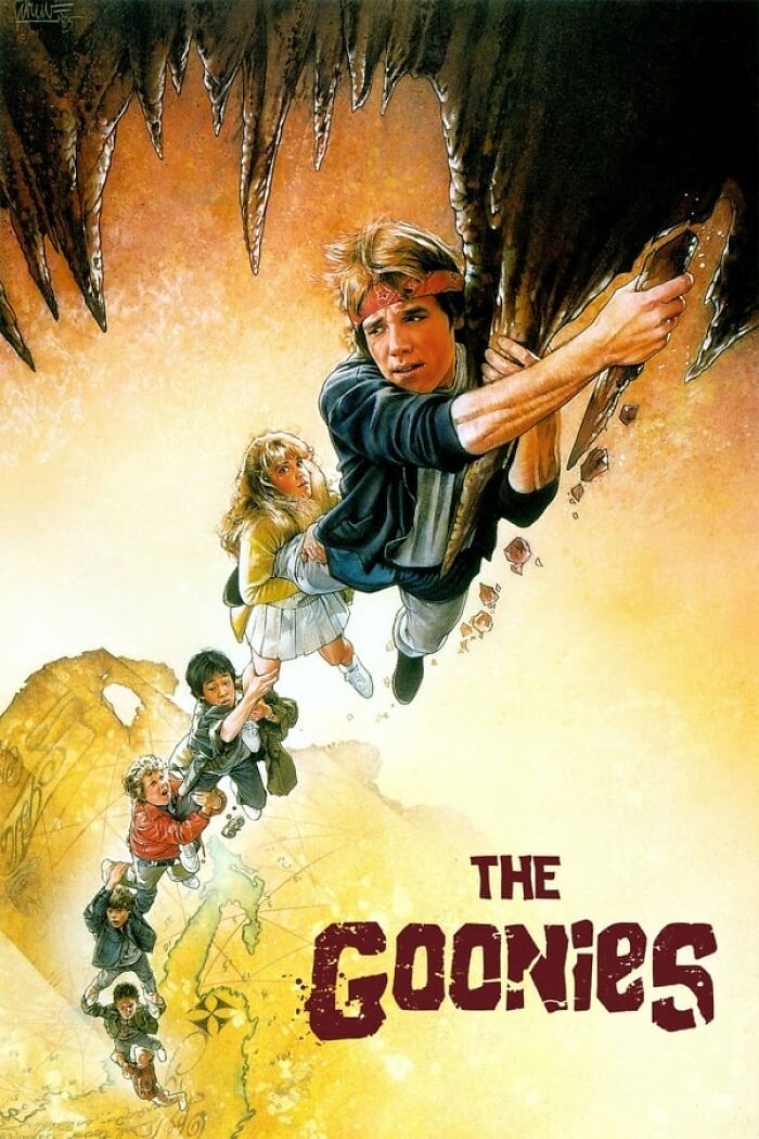 "The Goonies movie poster featuring adventurous kids climbing a rocky cave."