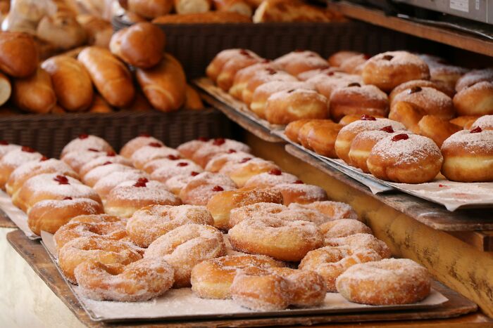 Assorted sugared donuts on display, highlighting experiences of winning a lifetime supply.