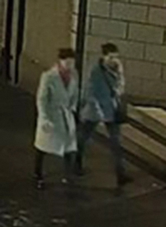 Two sisters walking at night before disappearing, caught on street camera.