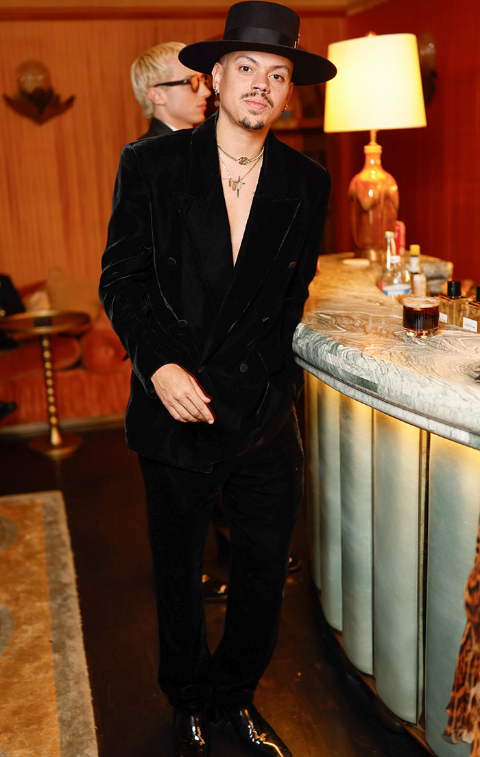 Evan Ross at Golden Globes 2025 after-party in black velvet suit and wide-brim hat, considered a worst dressed look.