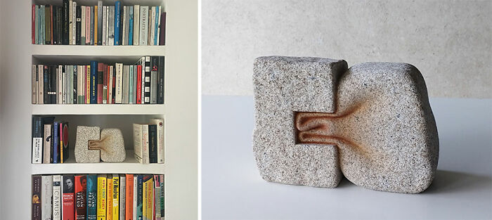 A stone sculpture resembling two rocks fused, placed on a bookshelf surrounded by books, showcasing soft stone artistry.