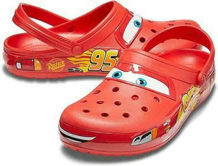 Red Crocs with a fun car design, featuring a cartoon character's face and the number 95, related to Funny-Camera-Roll-Finds.