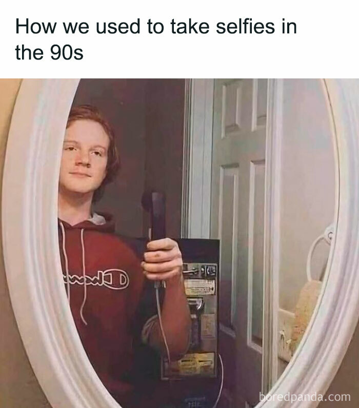 Person taking a mirror selfie with a landline phone, humorous Gen X nostalgia.