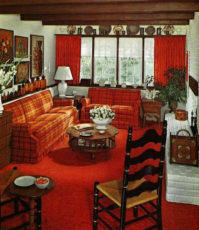 A retro Gen X living room with plaid sofas, red carpet, and vintage decor elements.