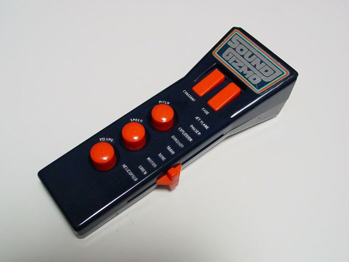 Retro Gen X sound gizmo with orange buttons on a white background.