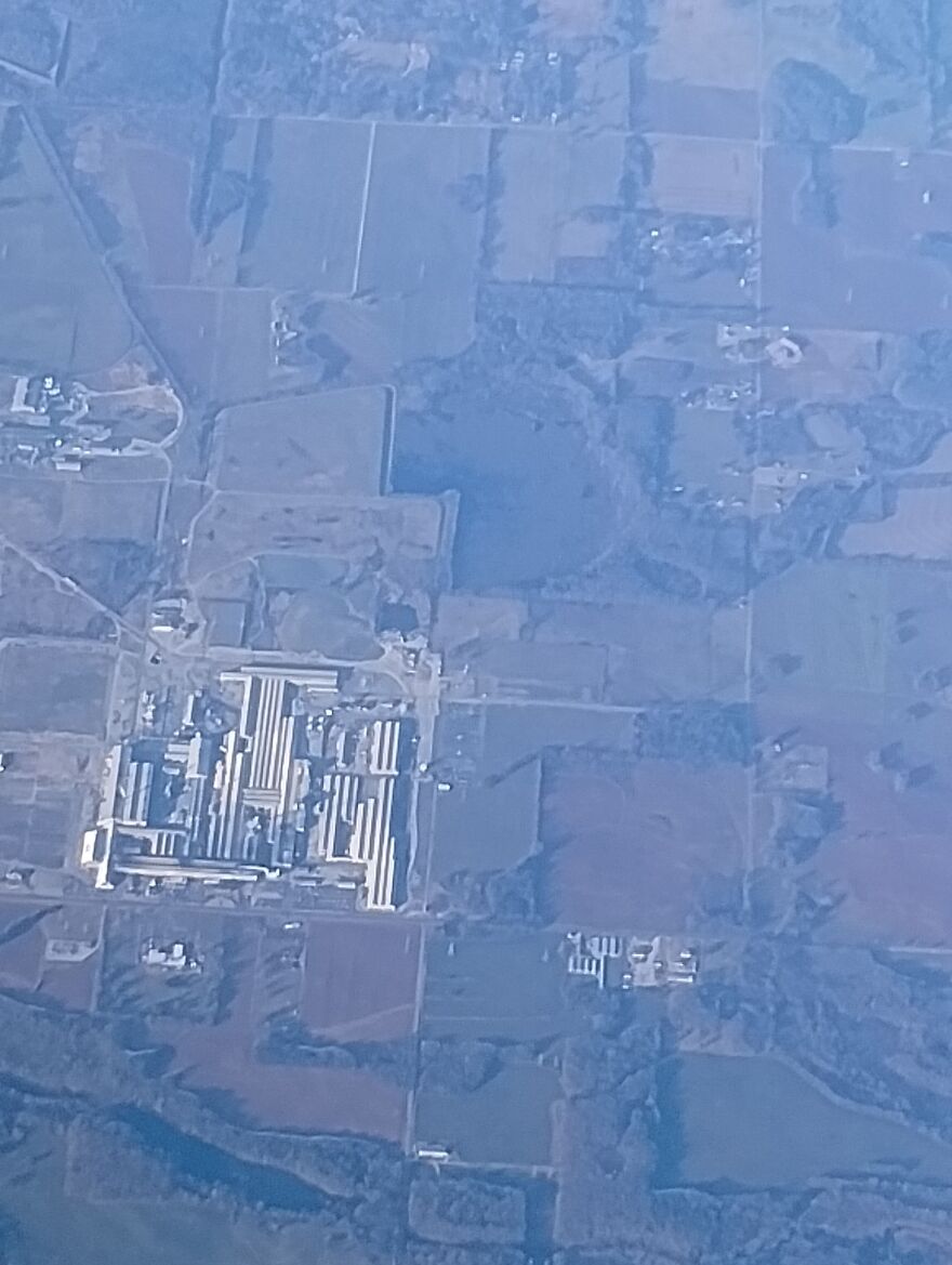 Strange Google Earth view of a large industrial complex surrounded by agricultural fields.