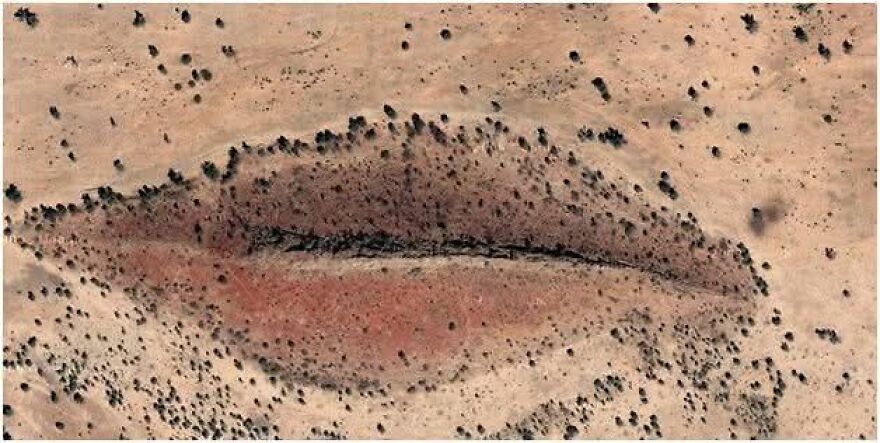 Aerial view of a strange land formation resembling a human eye on Google Earth.