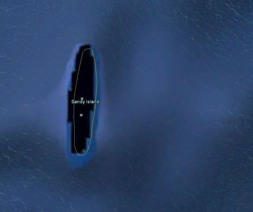 Sandy Island on Google Earth, a mysterious dark shape surrounded by blue ocean.