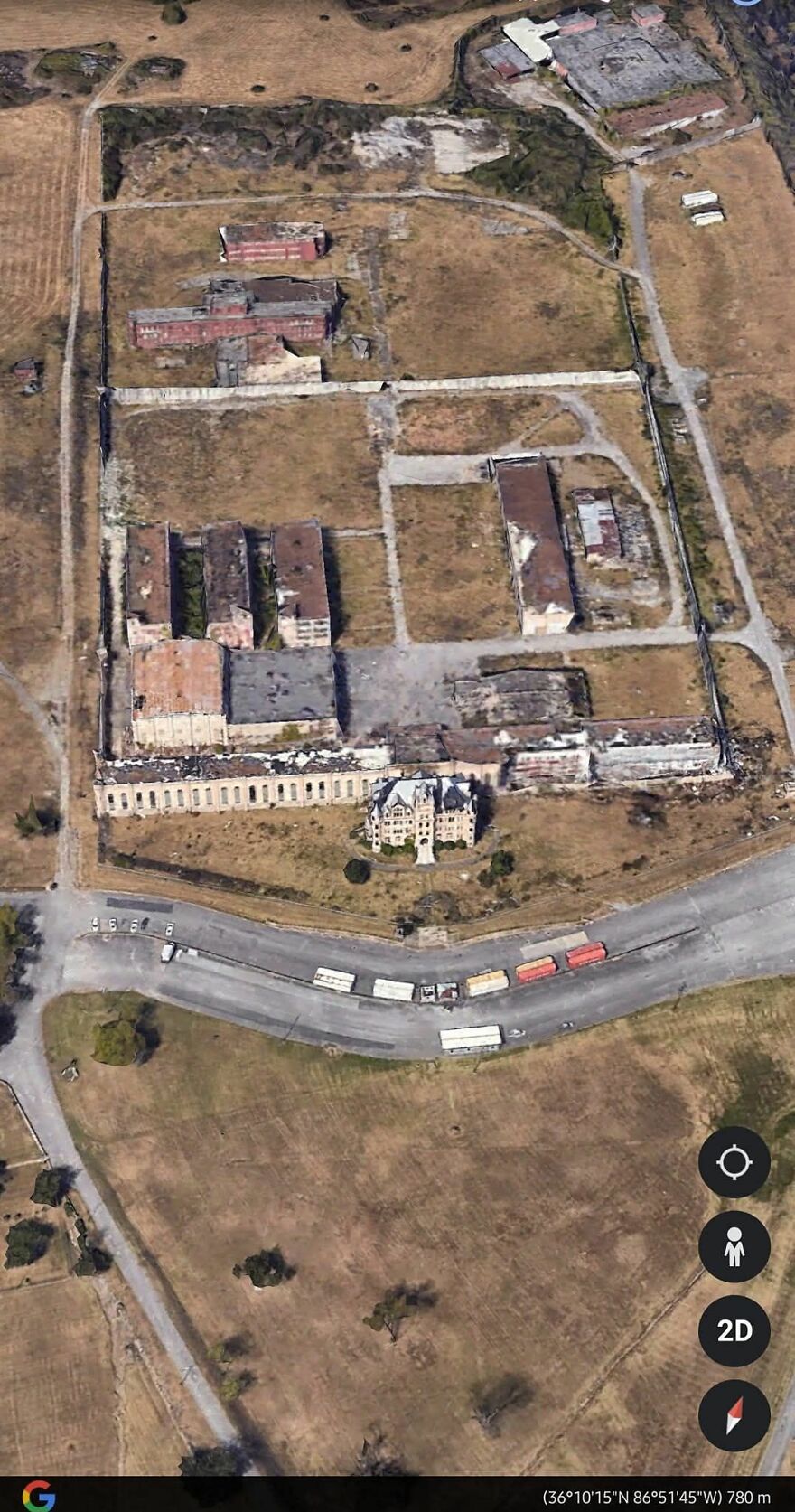 Strange findings on Google Earth show an abandoned industrial site with buildings and surrounding fields.