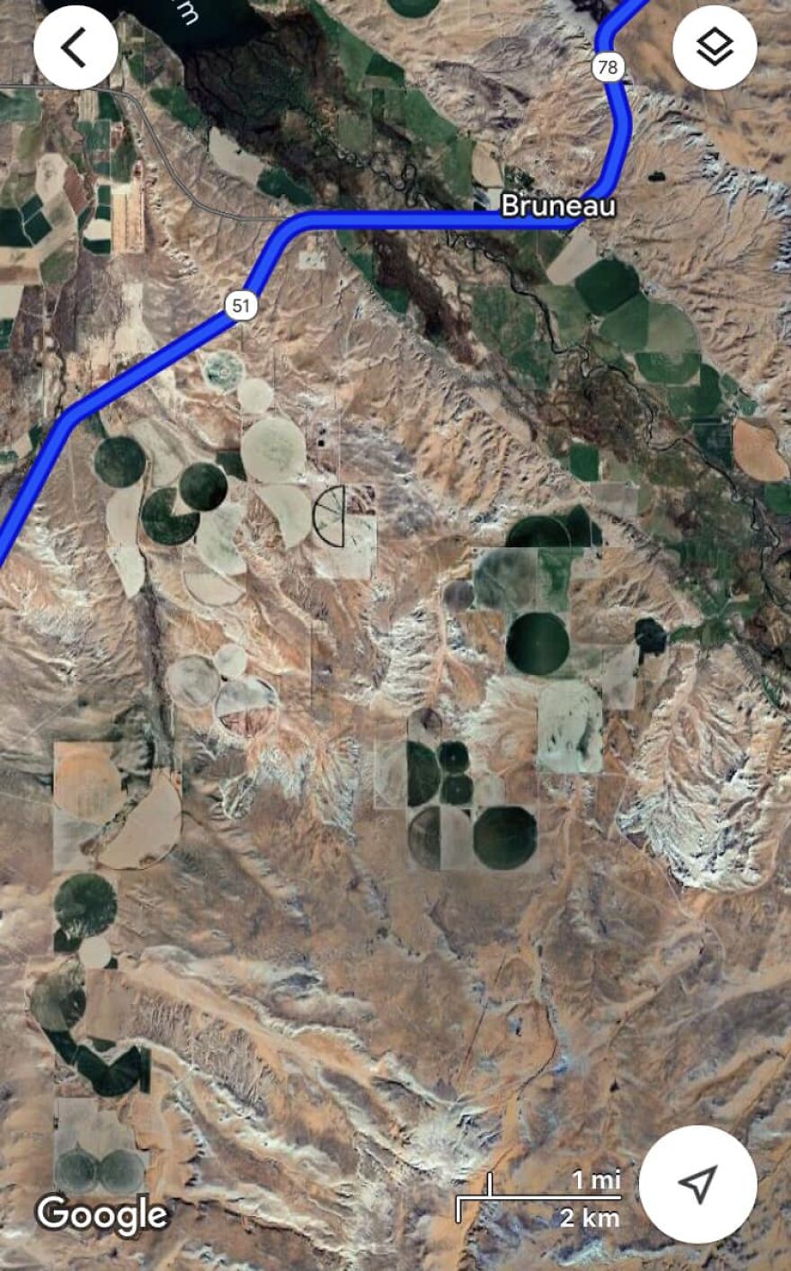 Strange circular patterns on Google Earth near Bruneau, Idaho, highlighted by road map overlay.