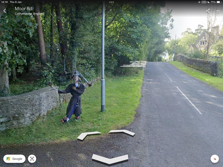 Strange figure in costume spotted on Google Earth next to a road in Cotherstone, England.