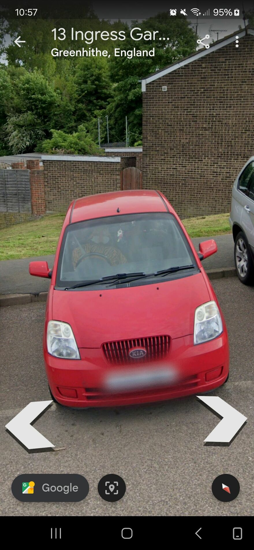 Red Kia car parked in Greenhithe, England, captured on Google Earth maps.