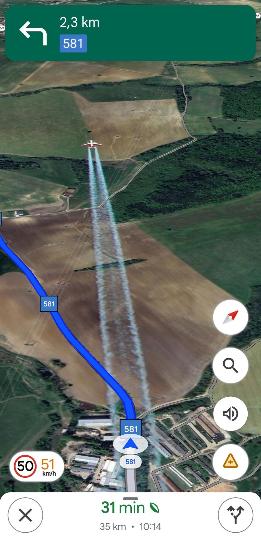 Strange thing found on Google Earth: airplane leaving a visible trail over rural landscape on navigation map.