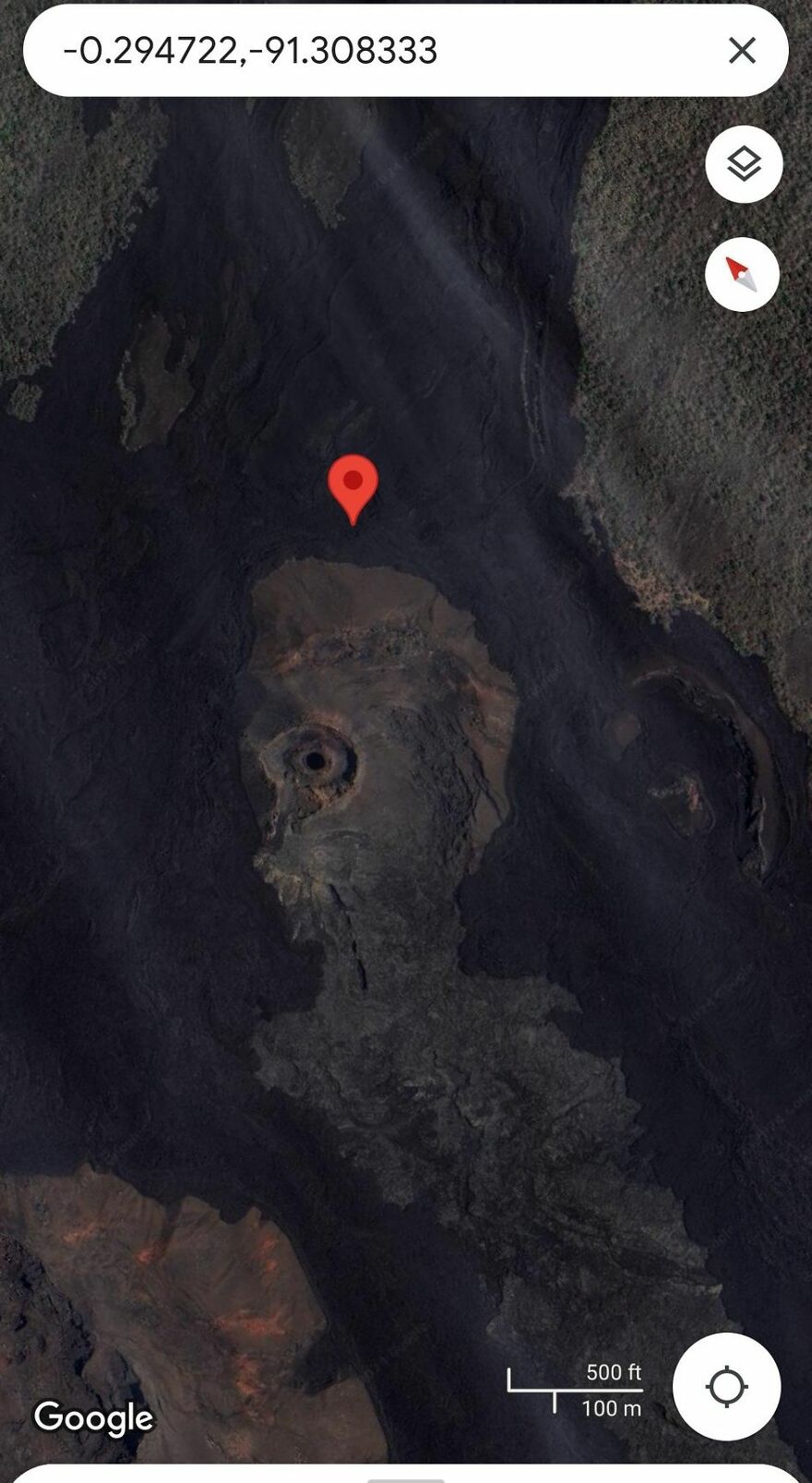 Strange land formation spotted on Google Earth with a red location pin marking coordinates.