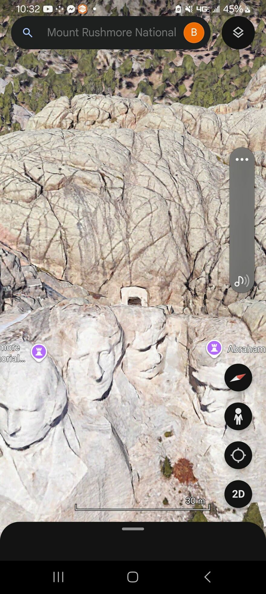 Strange view of Mount Rushmore captured on Google Earth with distorted features, showcasing a unique perspective of the monument.